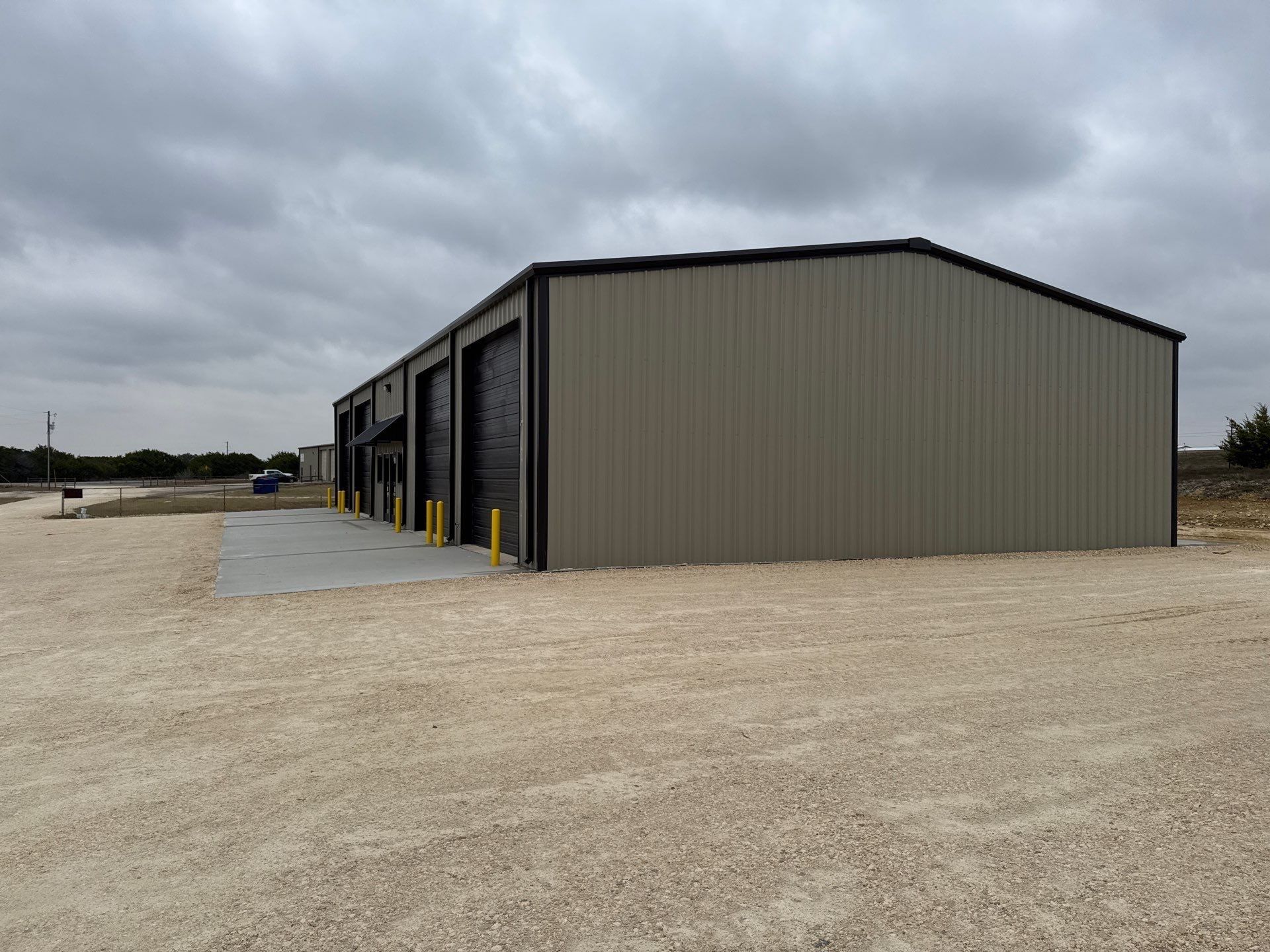 Multi-bay metal building with overhead doors from the approved TriTex project archive