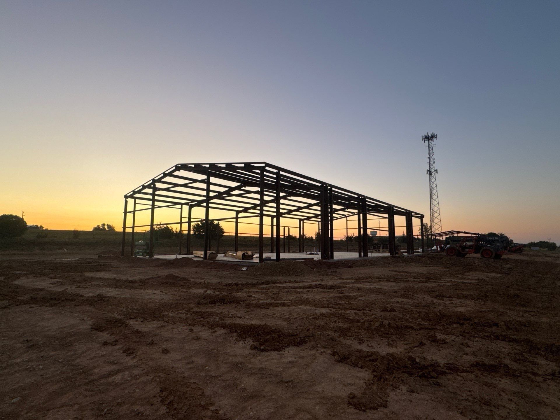 Steel building frame at sunset from the approved TriTex project archive